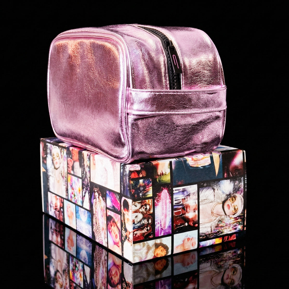 Side view of the Pink Aurora LED makeup bag resting on a Thread Original box, highlighting the carrying handle.