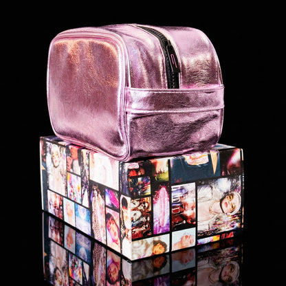 Side view of the Pink Aurora LED makeup bag resting on a Thread Original box, highlighting the carrying handle.