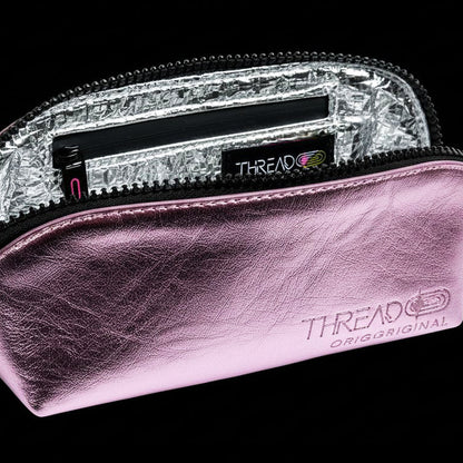Open Lyra compact makeup bag in metallic Pink, showing the silver interior lining.