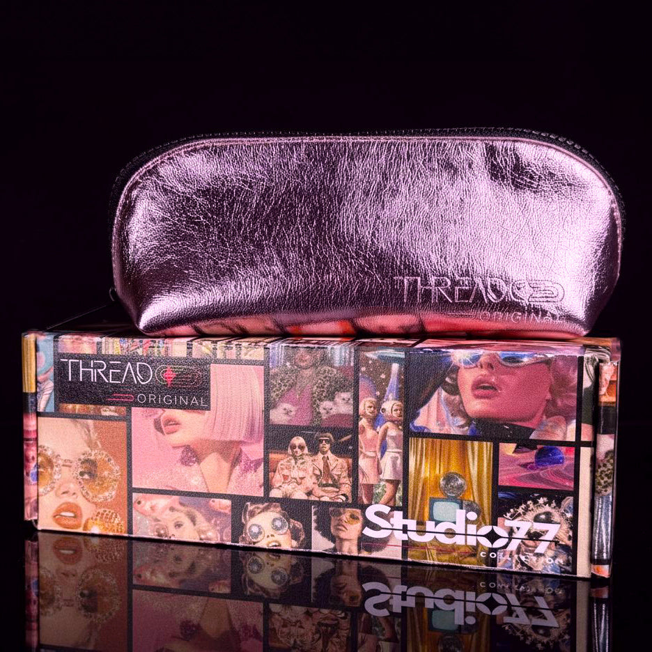 Closed Lyra makeup bag in metallic Pink, displayed on top of a Thread Original box.