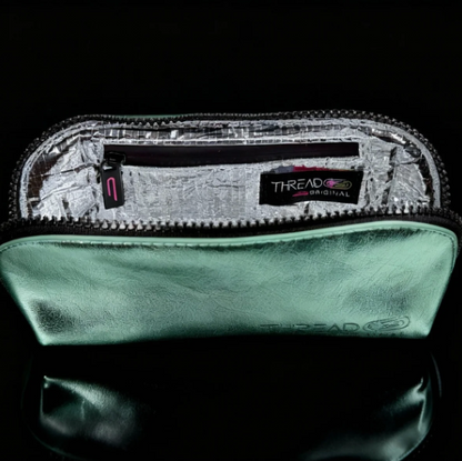 Open Lyra compact makeup bag in metallic Mint green, showing the silver interior lining.